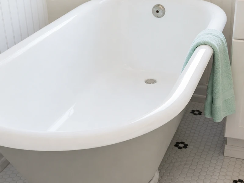 Refinished white clawfoot tub with a soft accent exterior in a Heritage District bathroom, Sunnyvale